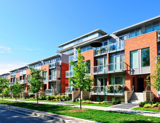 Modern town houses of brick and glass on urban street